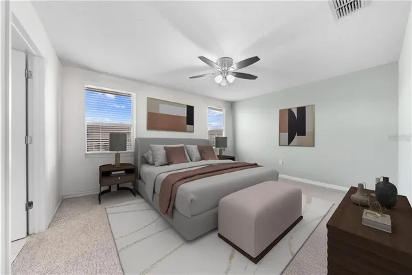 a bedroom with a bed and a chandelier