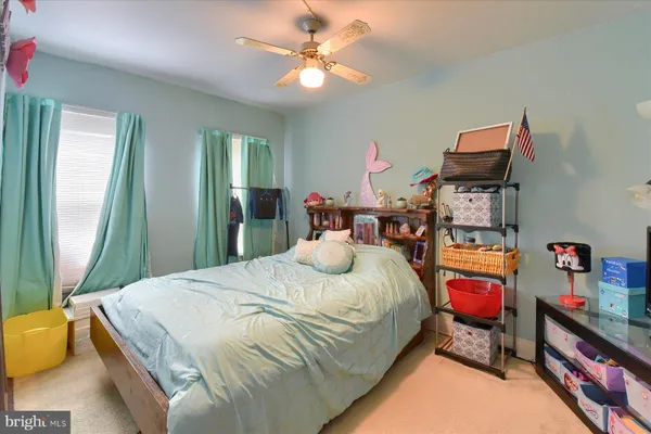 a bedroom with bed and window