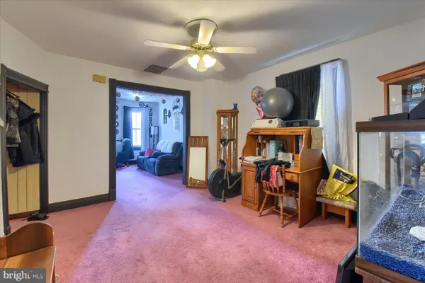 a view of a livingroom with furniture and a flat screen tv