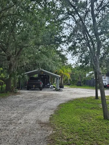 a house with trees in the background