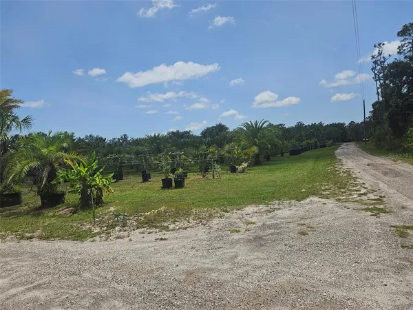 a view of a lake with a big yard