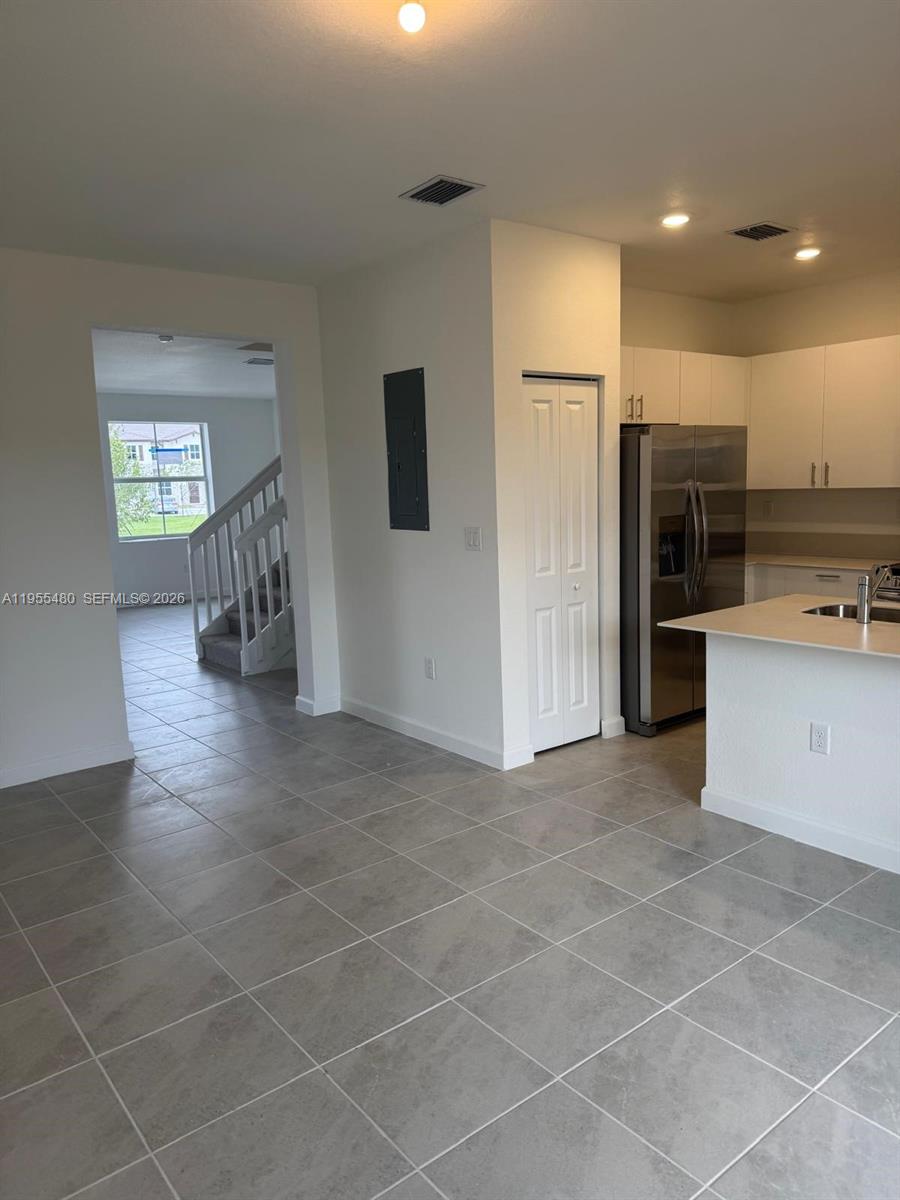 2721 Southeast 26th Road, Unit 2721 Homestead, FL 33035 - Photo 13 of 55 a view of kitchen with furniture and refrigerator