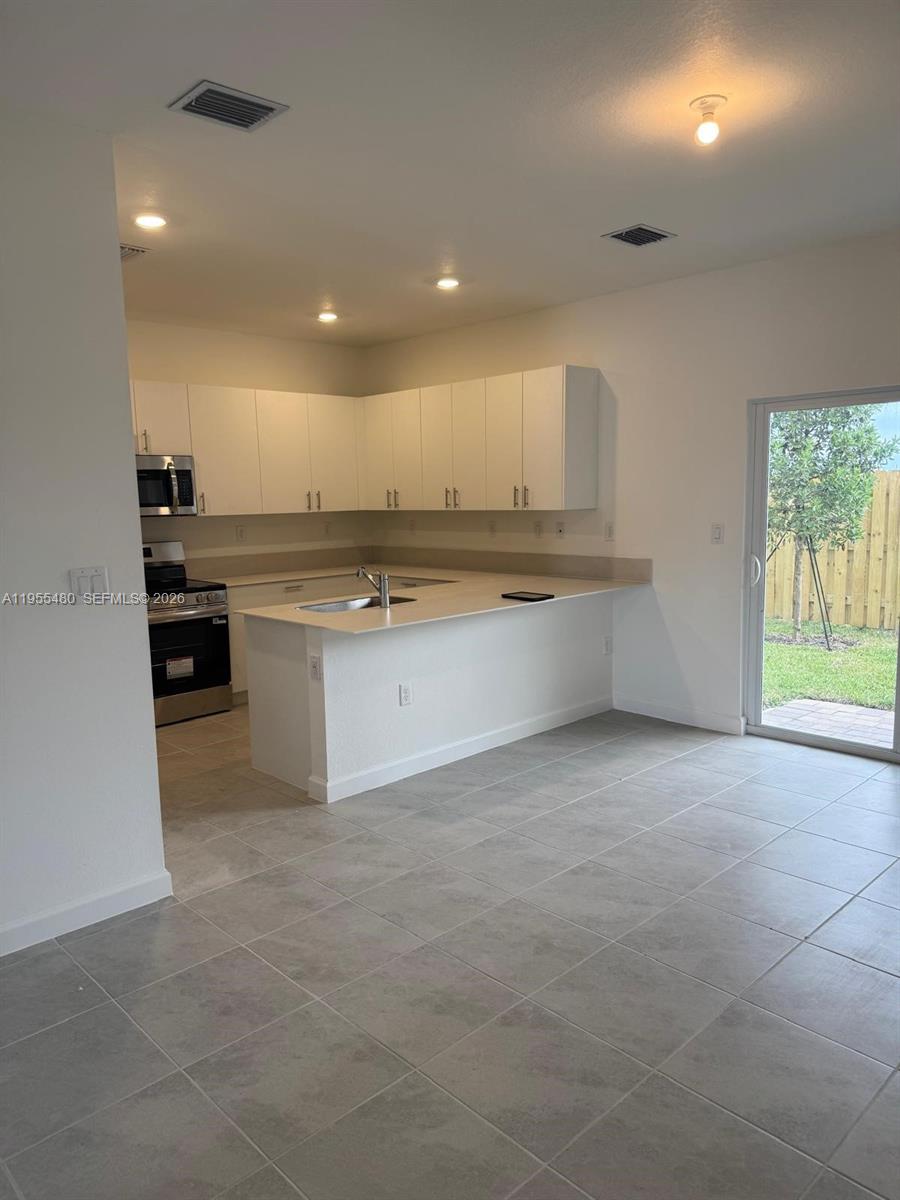 2721 Southeast 26th Road, Unit 2721 Homestead, FL 33035 - Photo 15 of 59 Livingroom Patio view