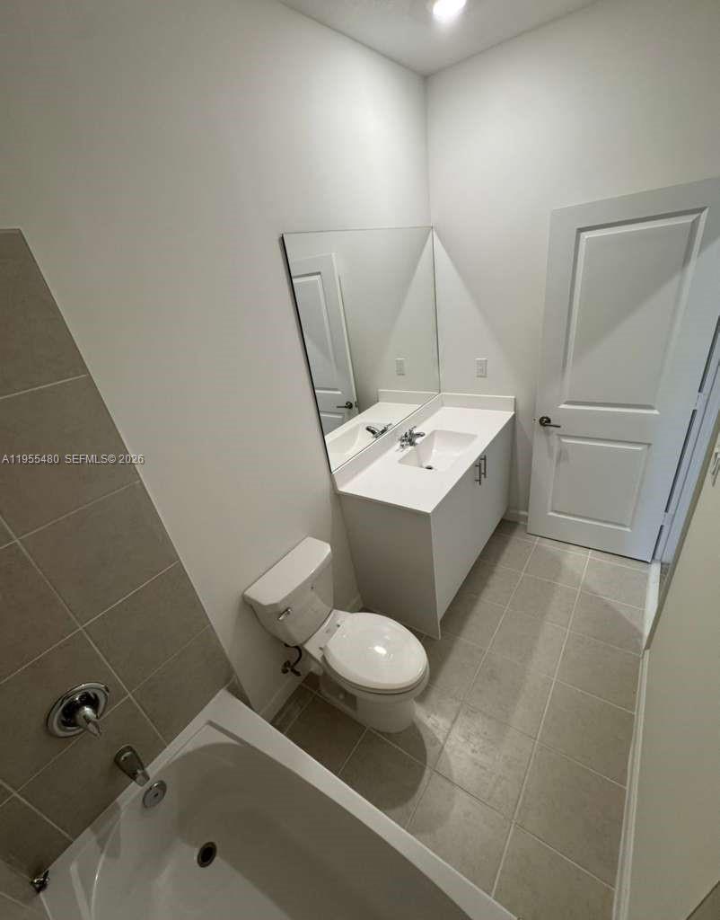 2721 Southeast 26th Road, Unit 2721 Homestead, FL 33035 - Photo 30 of 55 a bathroom with a sink toilet and tub