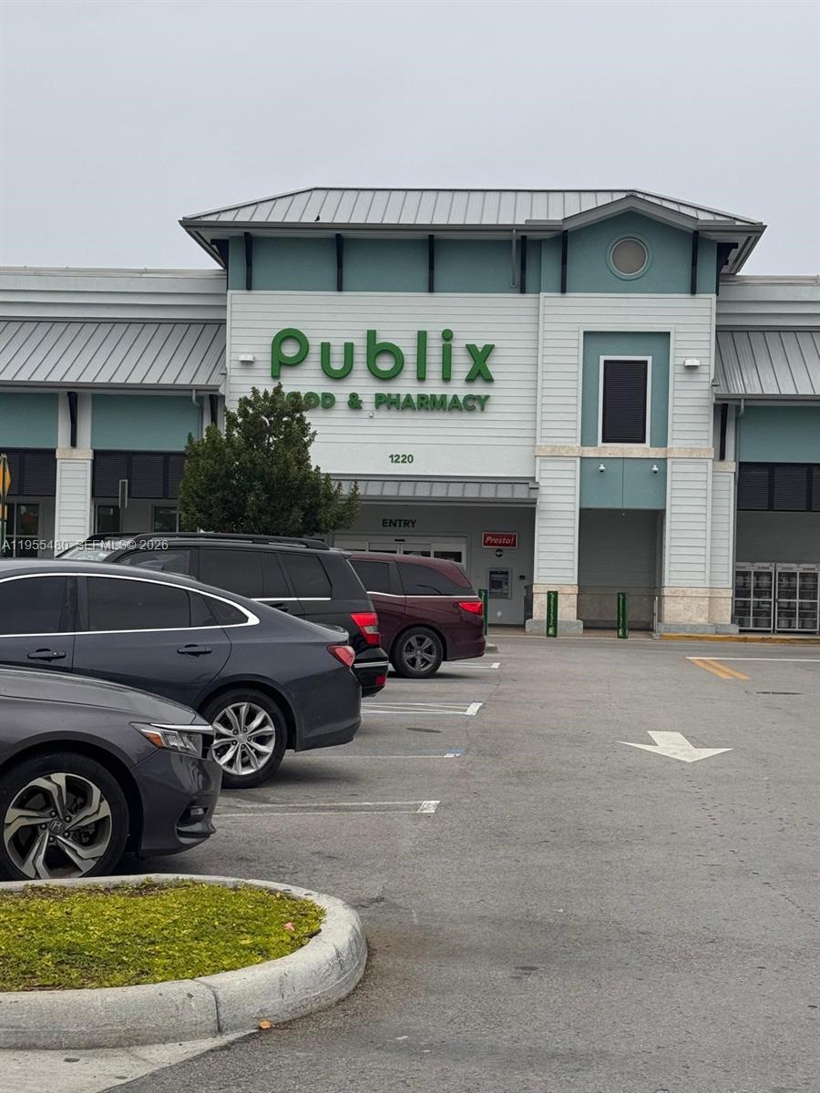 2721 Southeast 26th Road, Unit 2721 Homestead, FL 33035 - Photo 53 of 55 a car parked in front of a building