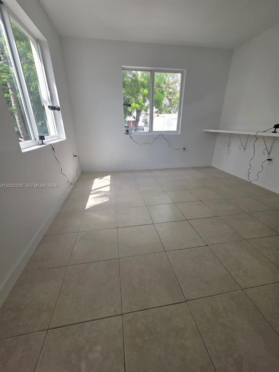 829 Southwest 3rd Street, Unit 831 Miami, FL 33130 - Photo 14 of 21 a view of an empty room with a window