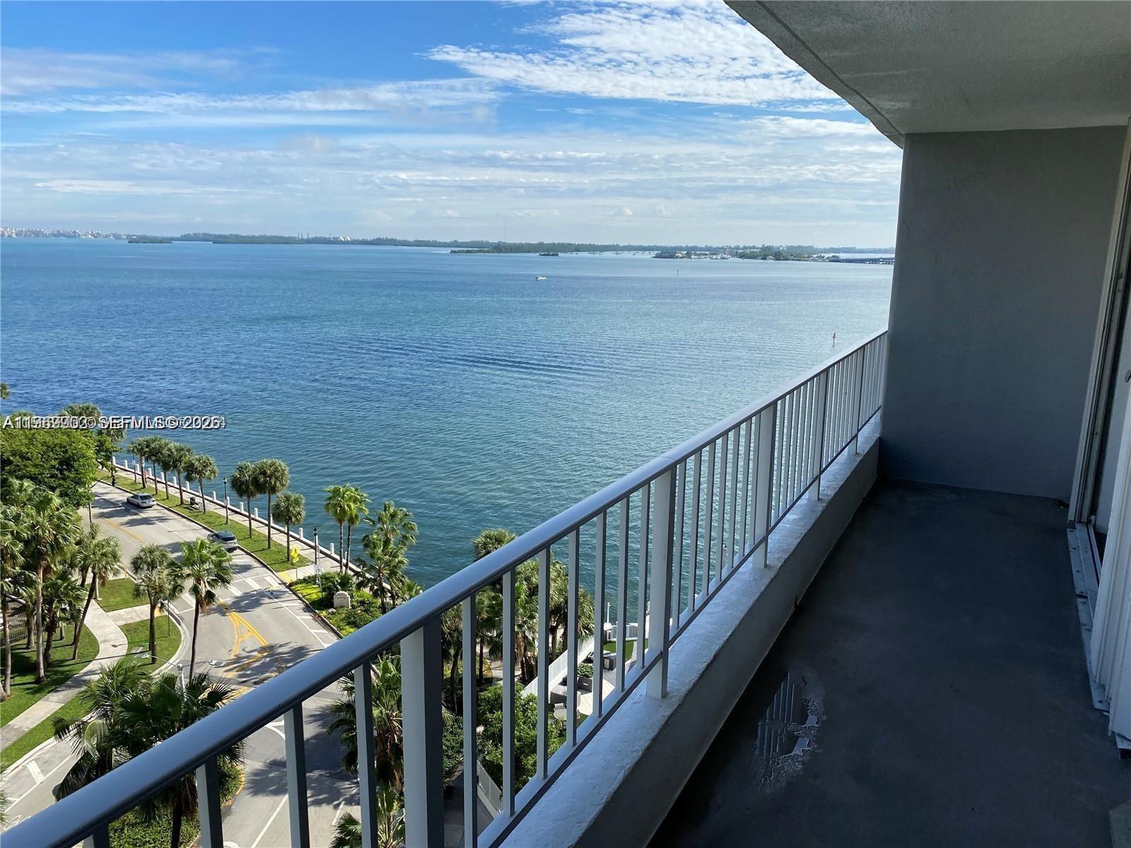 a view of balcony with wooden floor