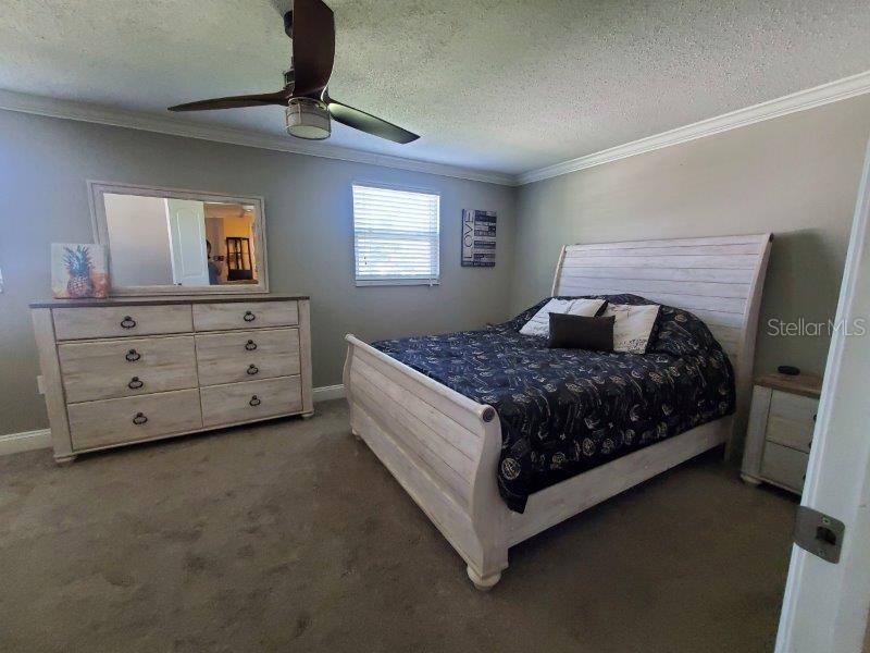 22274 Westchester Boulevard Port Charlotte, FL 33952 - Photo 11 of 18 a bedroom with a bed and window