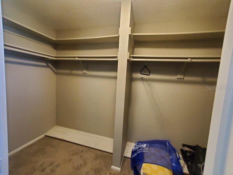 22274 Westchester Boulevard Port Charlotte, FL 33952 - Photo 13 of 18 a view of walk in closet with clothes