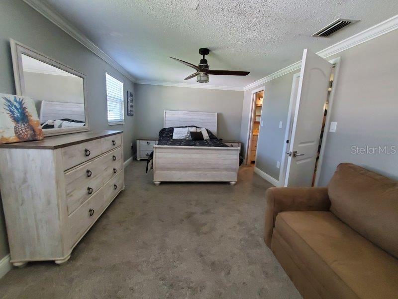22274 Westchester Boulevard Port Charlotte, FL 33952 - Photo 14 of 18 a living room with furniture and a ceiling fan