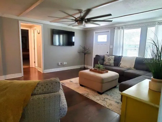 a living room with furniture and a window