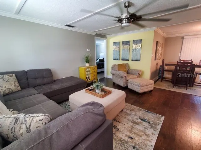 a living room with furniture and a window