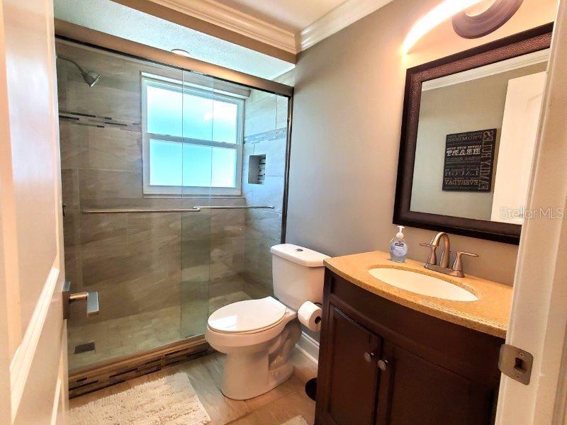 22274 Westchester Boulevard Port Charlotte, FL 33952 - Photo 9 of 18 a bathroom with a sink and a toilet