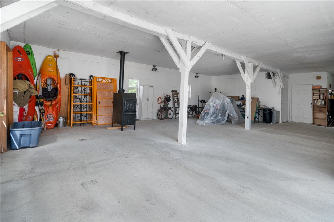 5903 Howell Road Locke, NY 13092 - Photo 28 of 44 Spacious heated 2+ car garage wired for a shop (complete with dust and staining rooms)
