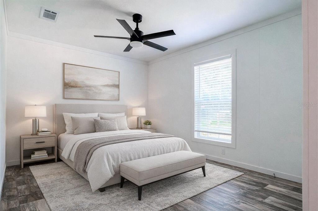 16108 Gupton Street Brooksville, FL 34613 - Photo 14 of 27 a bedroom with a bed and a window