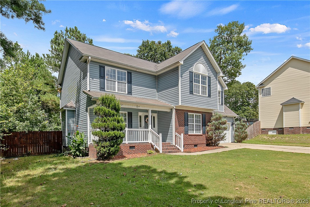 15 Rockingham Street Spring Lake, NC 28390 - Photo 3 of 15 a front view of a house with a yard
