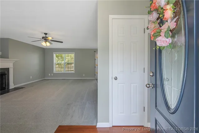 an entryway with a flower pot and a window