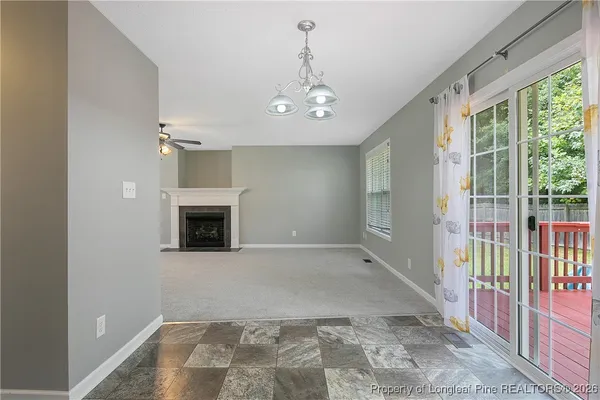 wooden floor in an empty room with a fireplace