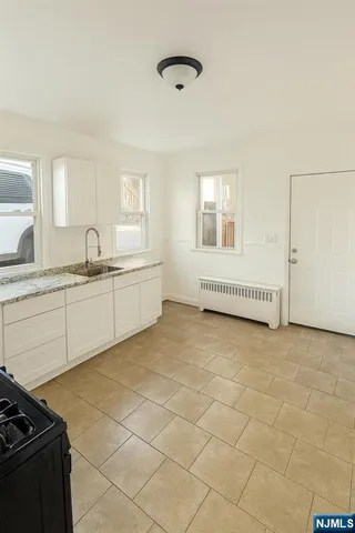 a kitchen with a sink and cabinets