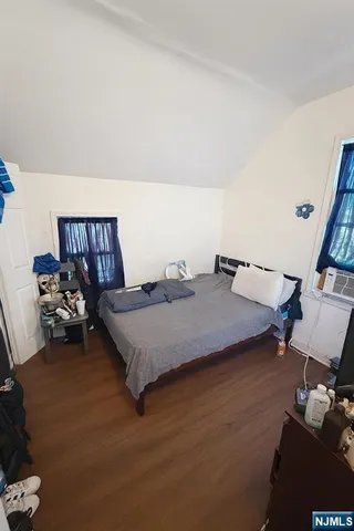 a bedroom with bed and window