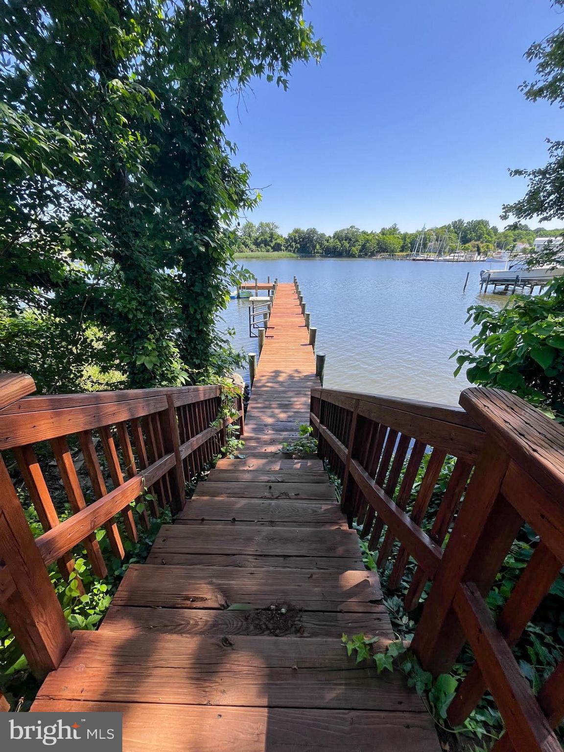 Lot 17 Vinter Lane Pasadena, MD 21122 - Photo 24 of 42 a view of a roof deck with wooden floor and fence next to a yard