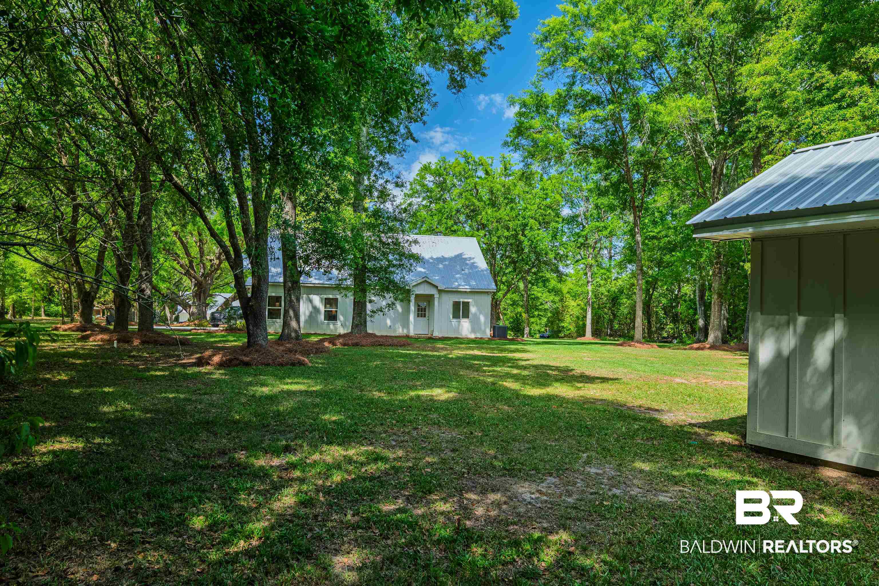 19121 Boothe Road Fairhope, AL 36532 - Photo 27 of 41 View of green lawn with view of wooded area