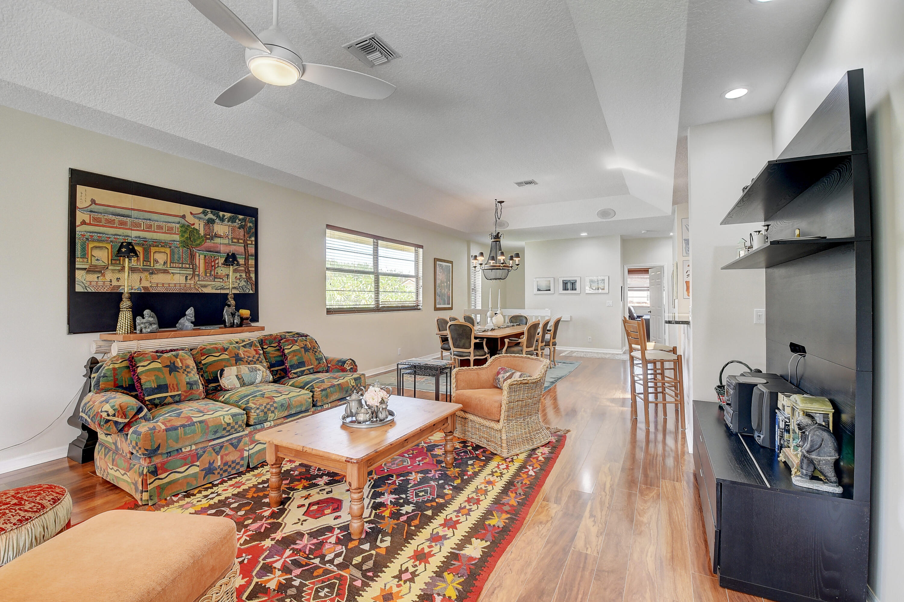 8652 Vía Reale, Unit 2 Boca Raton, FL 33496 - Photo 11 of 58 a living room with furniture and a flat screen tv