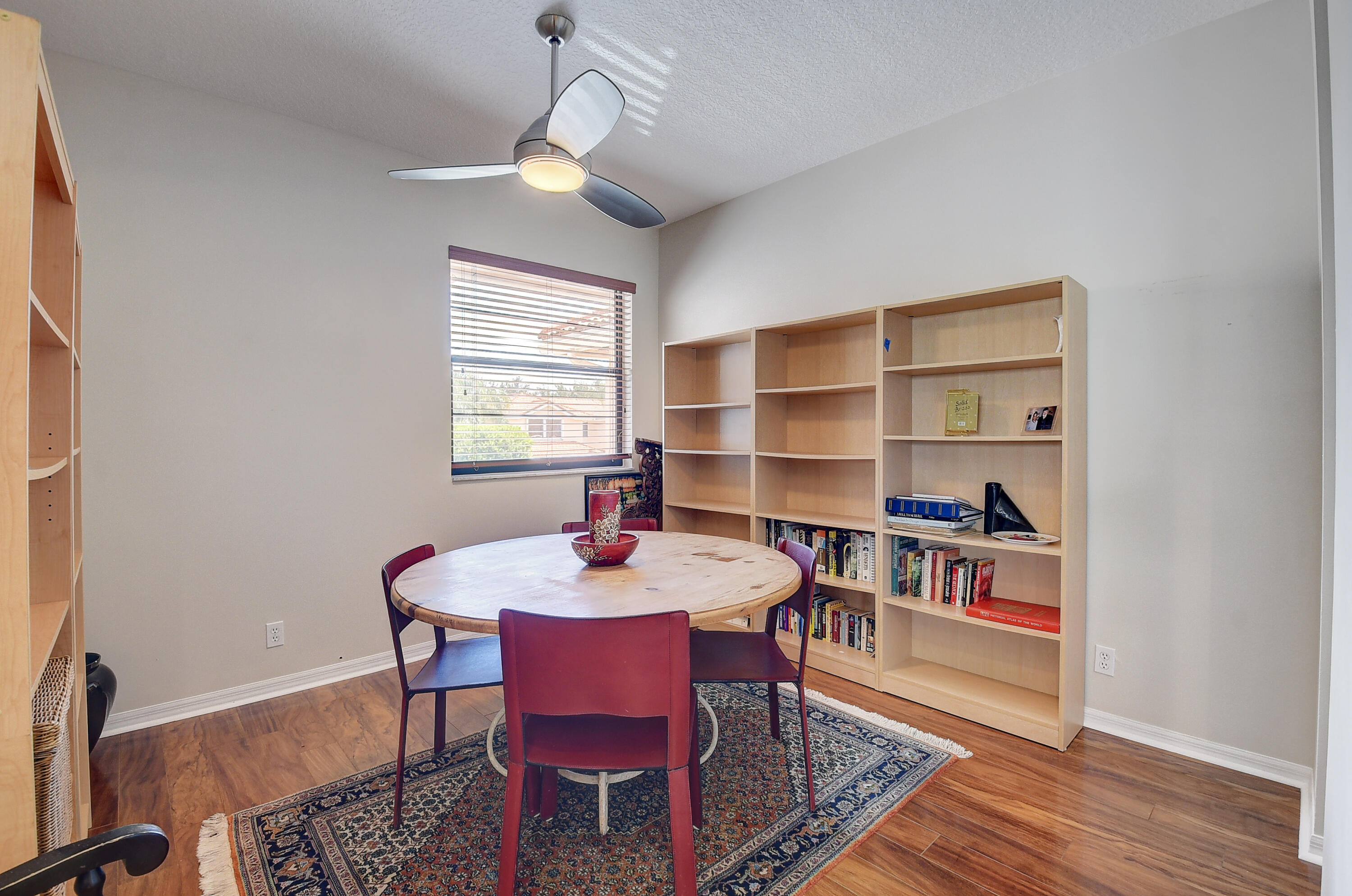 8652 Vía Reale, Unit 2 Boca Raton, FL 33496 - Photo 16 of 58 a view of a dining room with furniture window and wooden floor