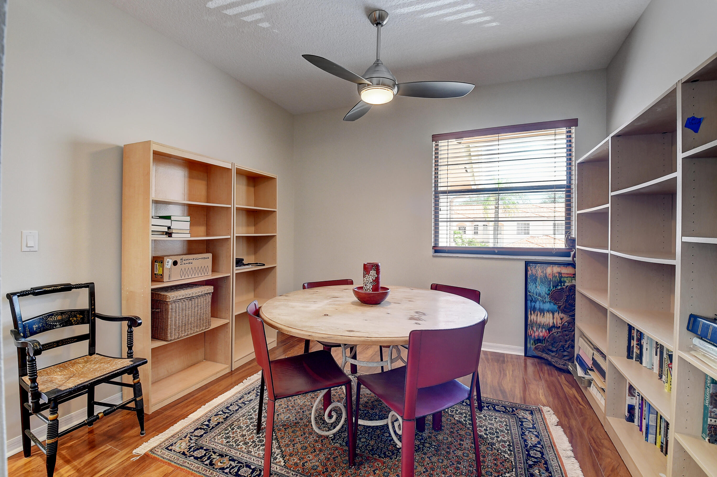 8652 Vía Reale, Unit 2 Boca Raton, FL 33496 - Photo 17 of 58 a view of a dining room with furniture window and wooden floor