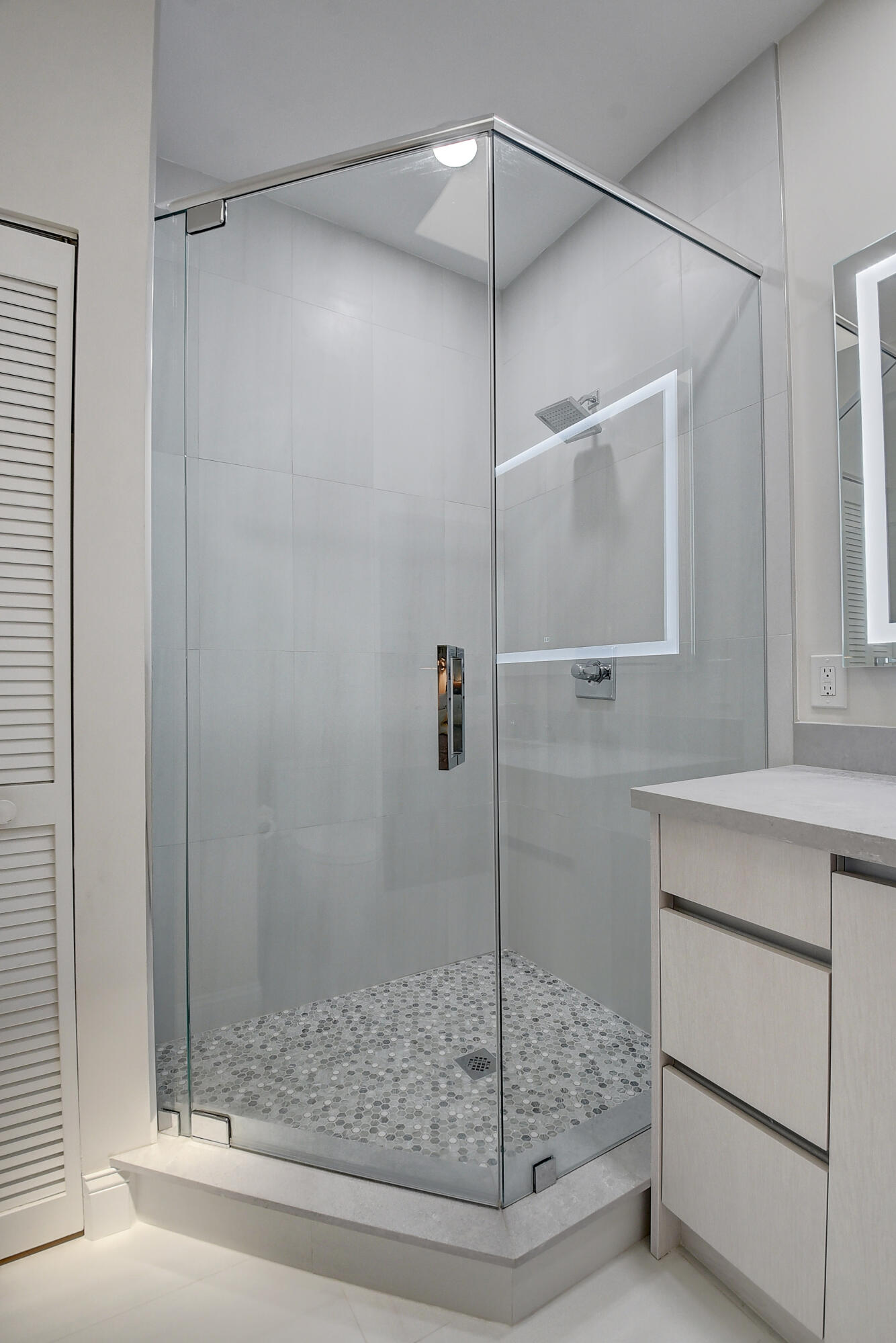 8652 Vía Reale, Unit 2 Boca Raton, FL 33496 - Photo 23 of 58 a bathroom with a shower and a sink