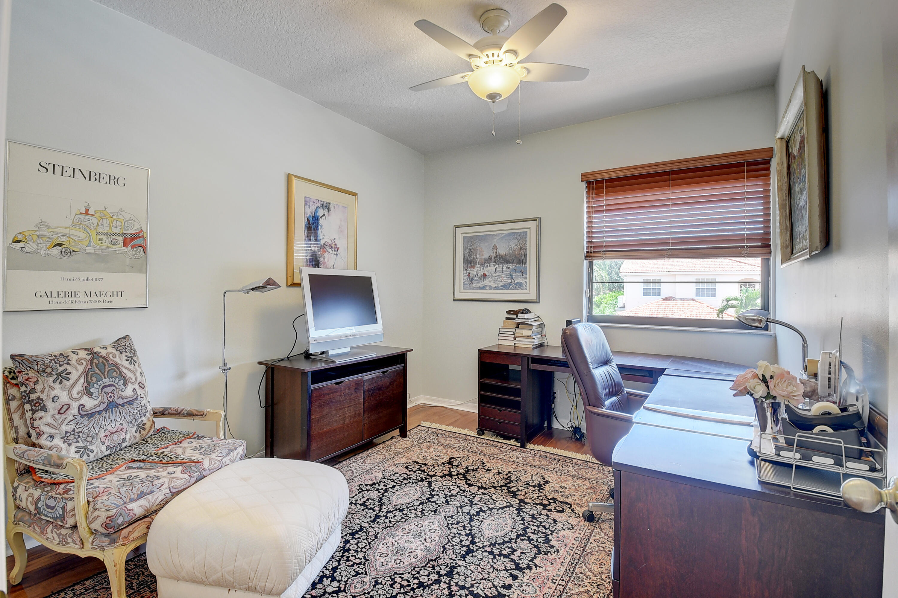 8652 Vía Reale, Unit 2 Boca Raton, FL 33496 - Photo 24 of 58 a living room with furniture and a flat screen tv