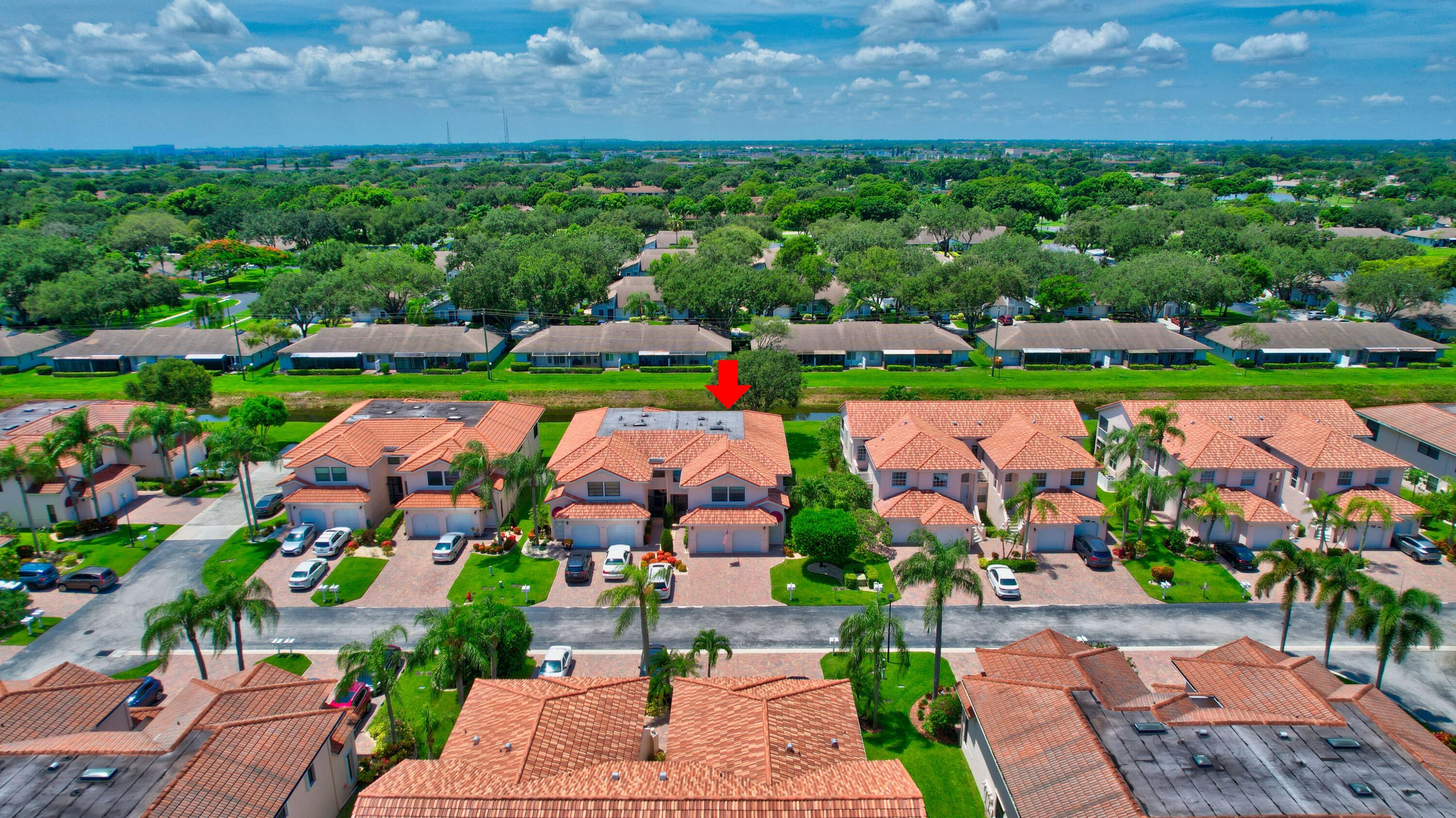 8652 Vía Reale, Unit 2 Boca Raton, FL 33496 - Photo 37 of 58 a view of an outdoor space yard and swimming pool