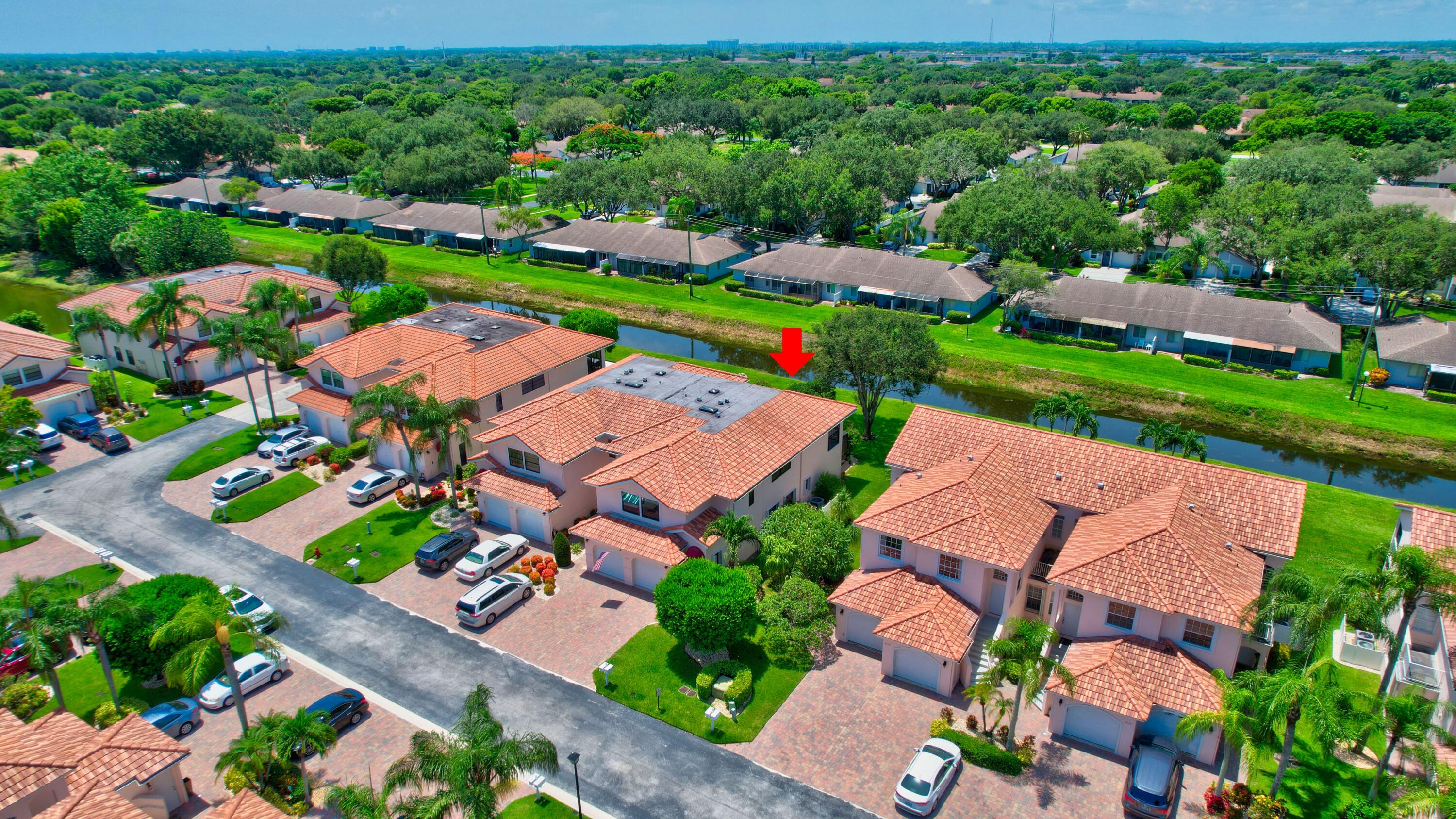 8652 Vía Reale, Unit 2 Boca Raton, FL 33496 - Photo 44 of 58 an aerial view of residential houses with outdoor space and street view