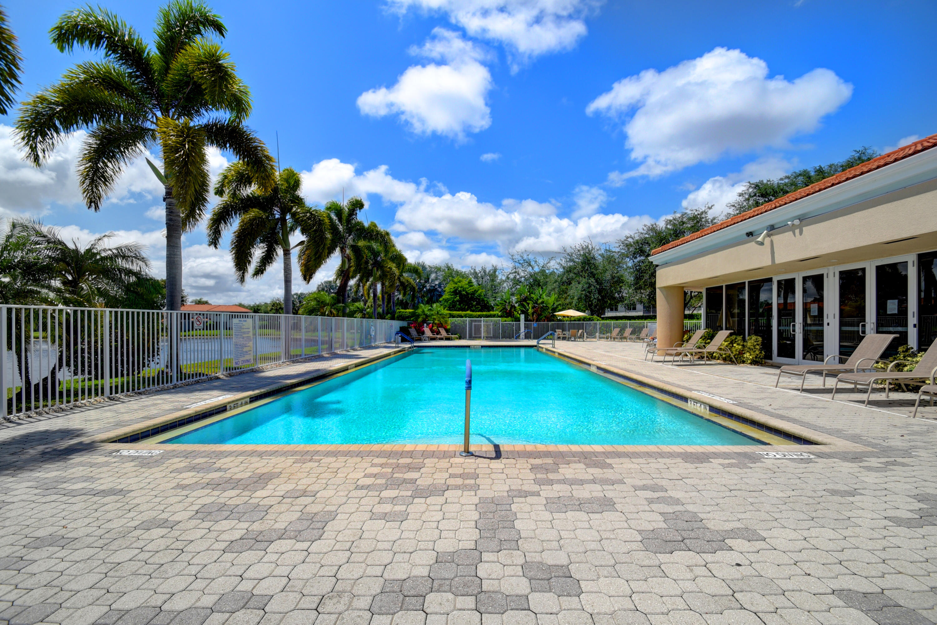 8652 Vía Reale, Unit 2 Boca Raton, FL 33496 - Photo 45 of 58 a view of a backyard with swimming pool