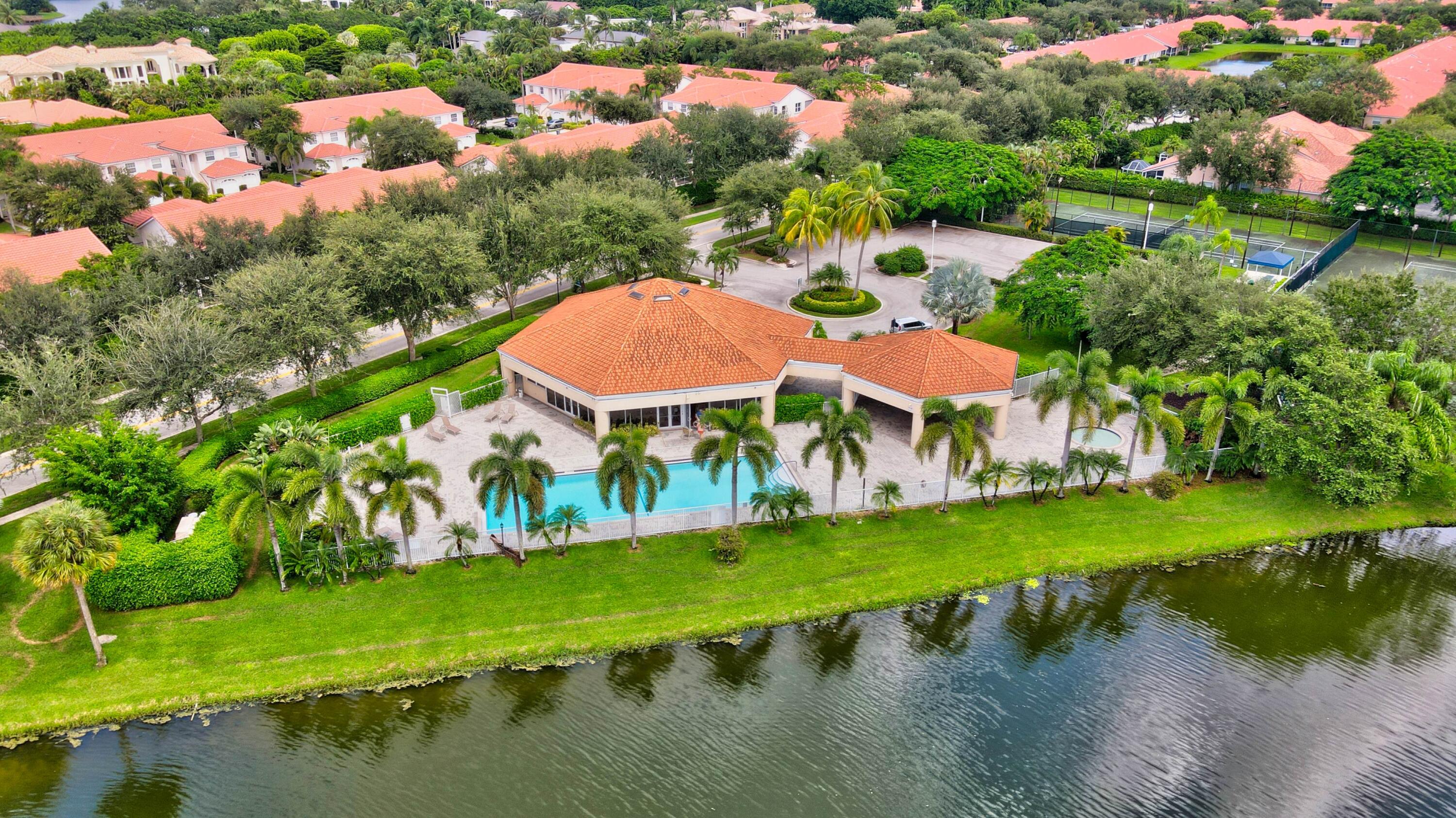8652 Vía Reale, Unit 2 Boca Raton, FL 33496 - Photo 55 of 58 an aerial view of residential houses with outdoor space and lake view
