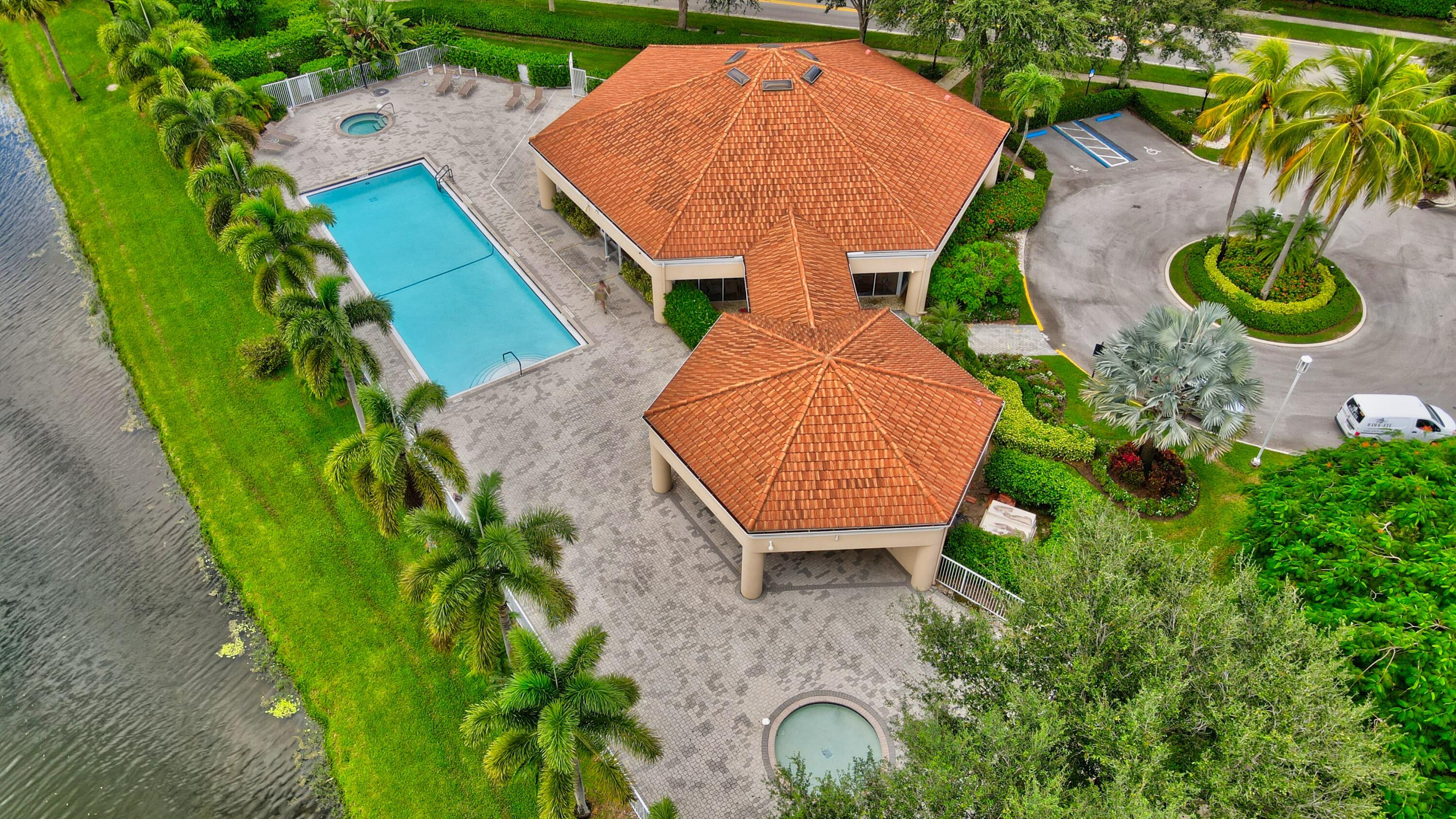 8652 Vía Reale, Unit 2 Boca Raton, FL 33496 - Photo 57 of 58 an aerial view of a house with outdoor space and swimming pool