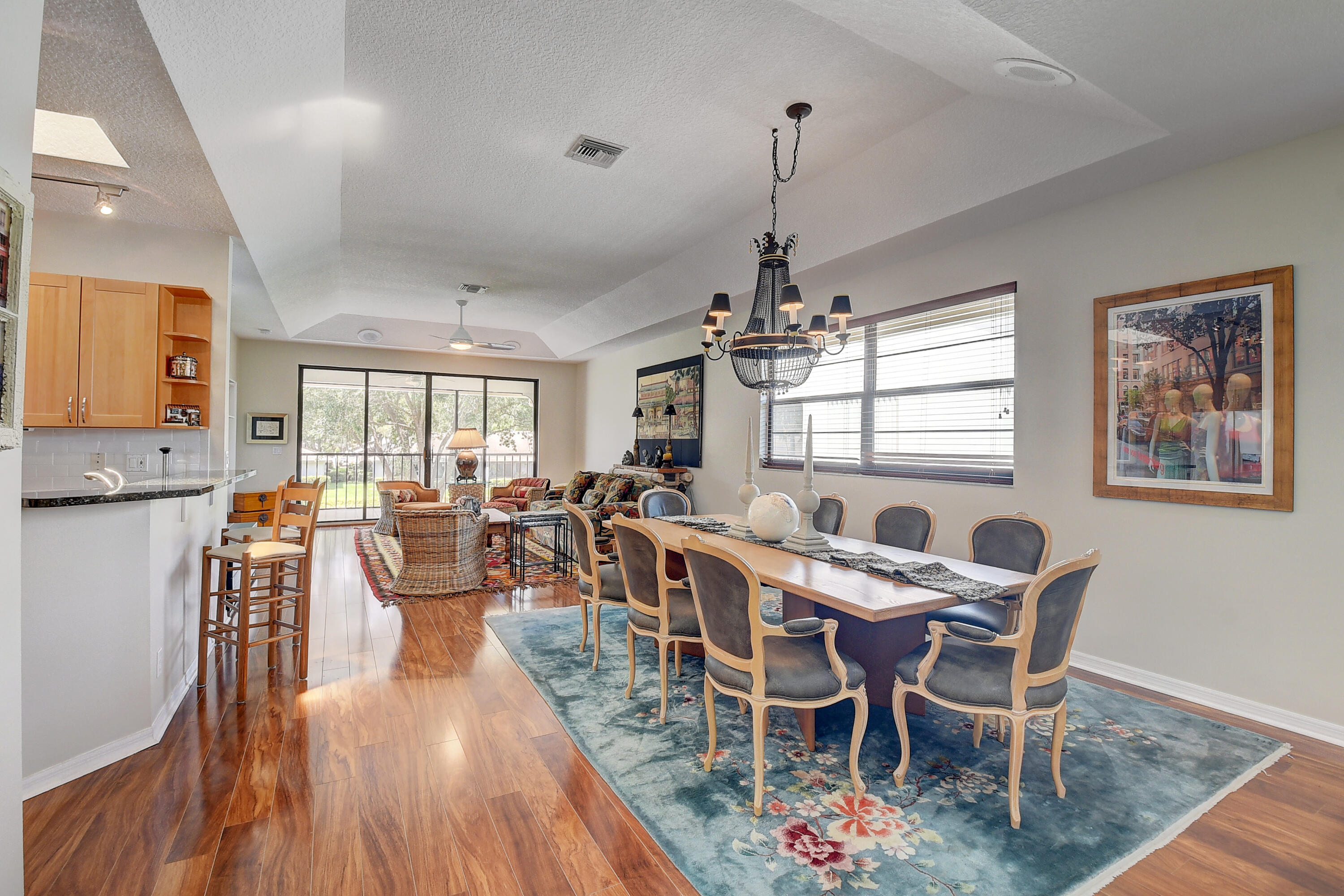 8652 Vía Reale, Unit 2 Boca Raton, FL 33496 - Photo 7 of 58 a view of a dining room with furniture window and wooden floor