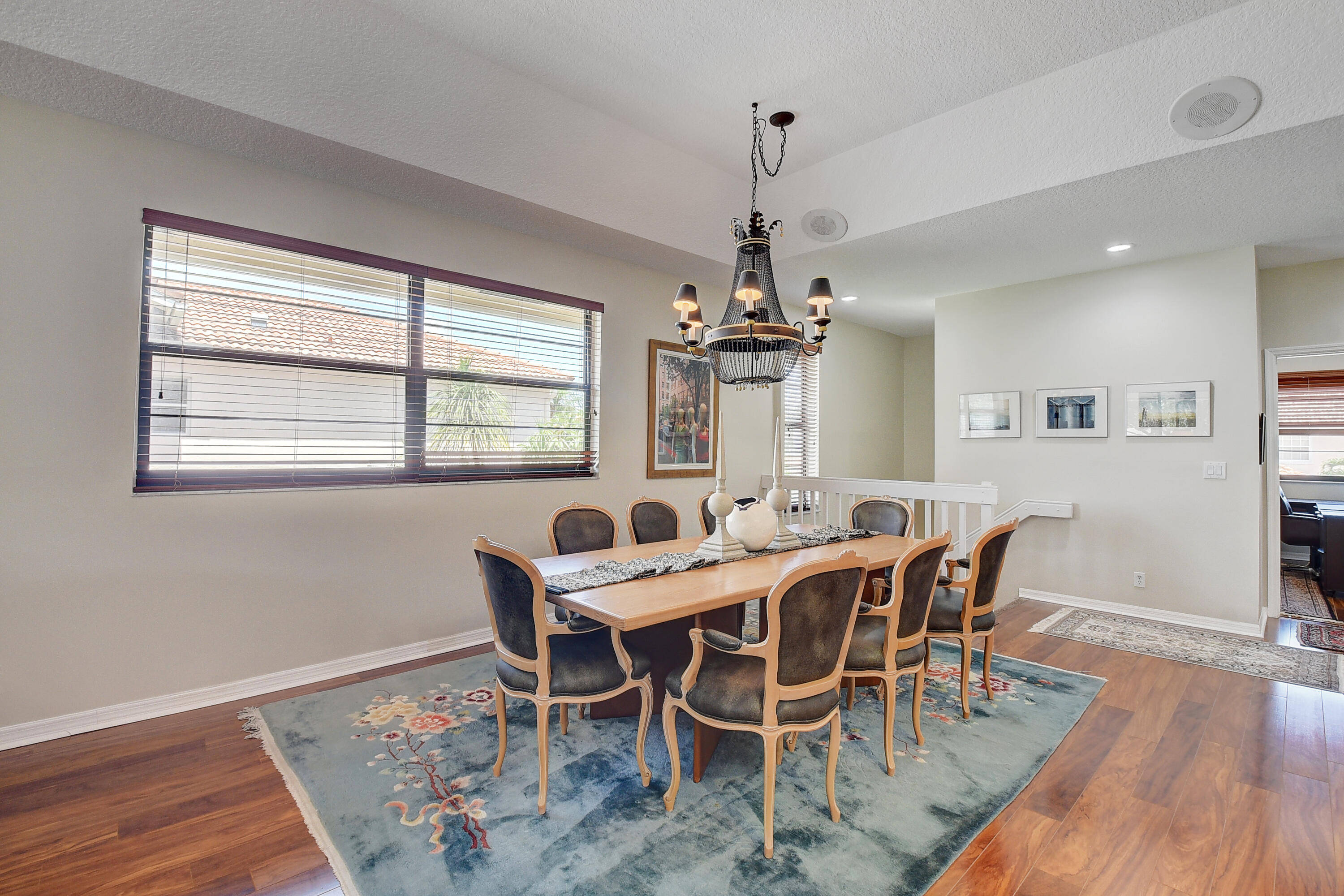 8652 Vía Reale, Unit 2 Boca Raton, FL 33496 - Photo 8 of 58 a view of a dining room with furniture window and wooden floor