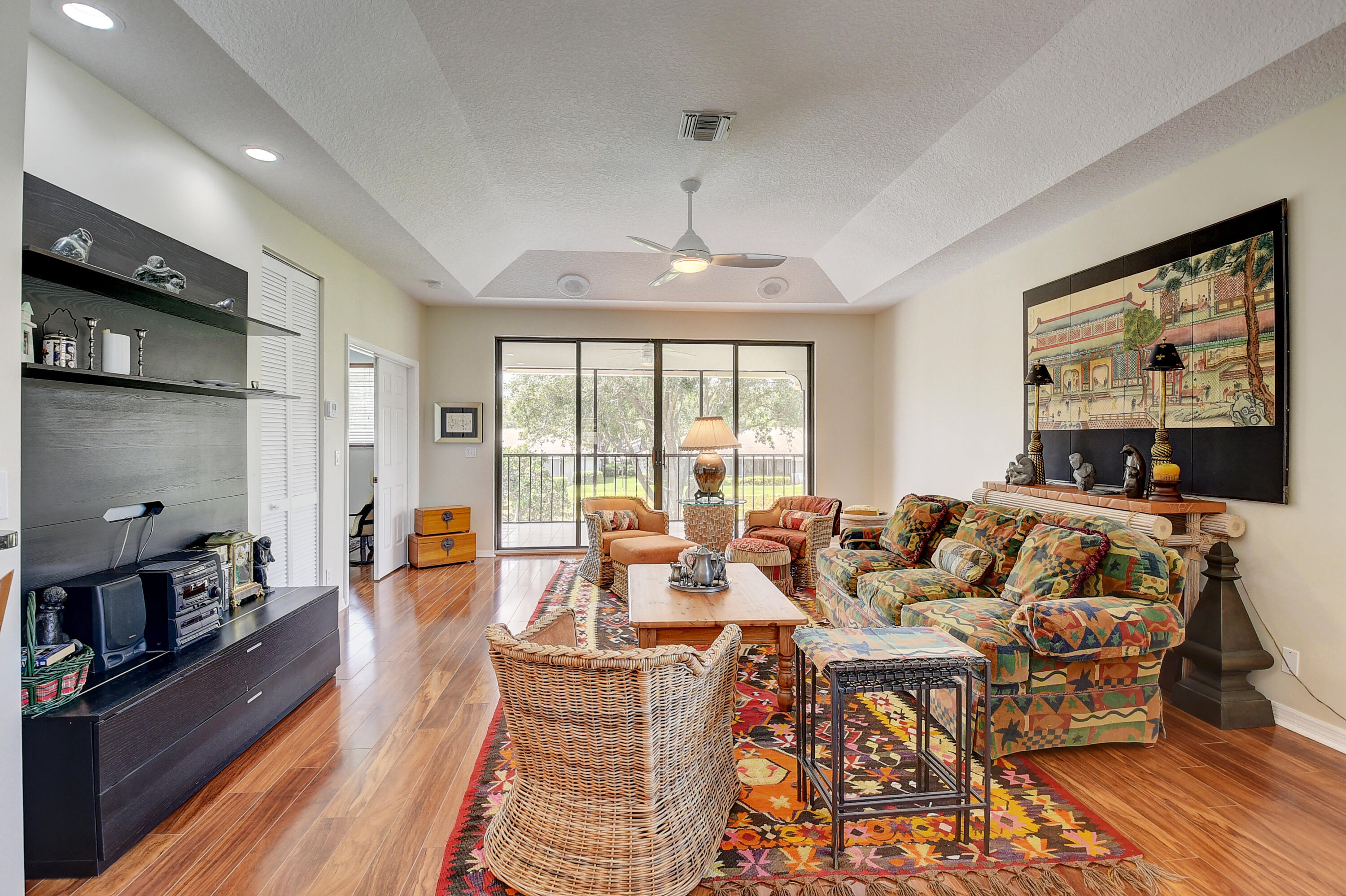 8652 Vía Reale, Unit 2 Boca Raton, FL 33496 - Photo 9 of 58 a living room with furniture and a flat screen tv