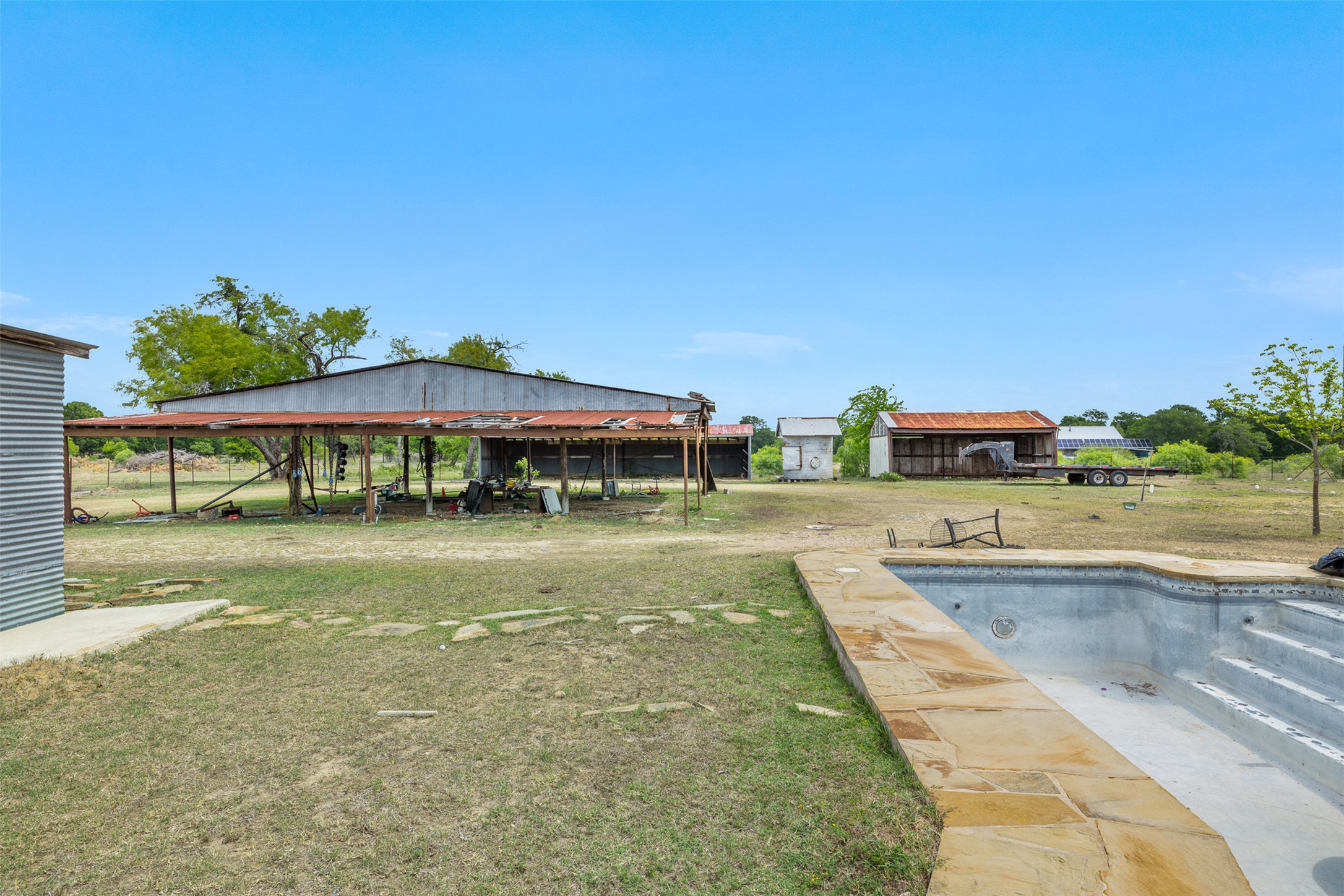 9765 A State Park Road Lockhart, TX 78644 - Photo 18 of 30 View of pool with a lawn and an empty pool