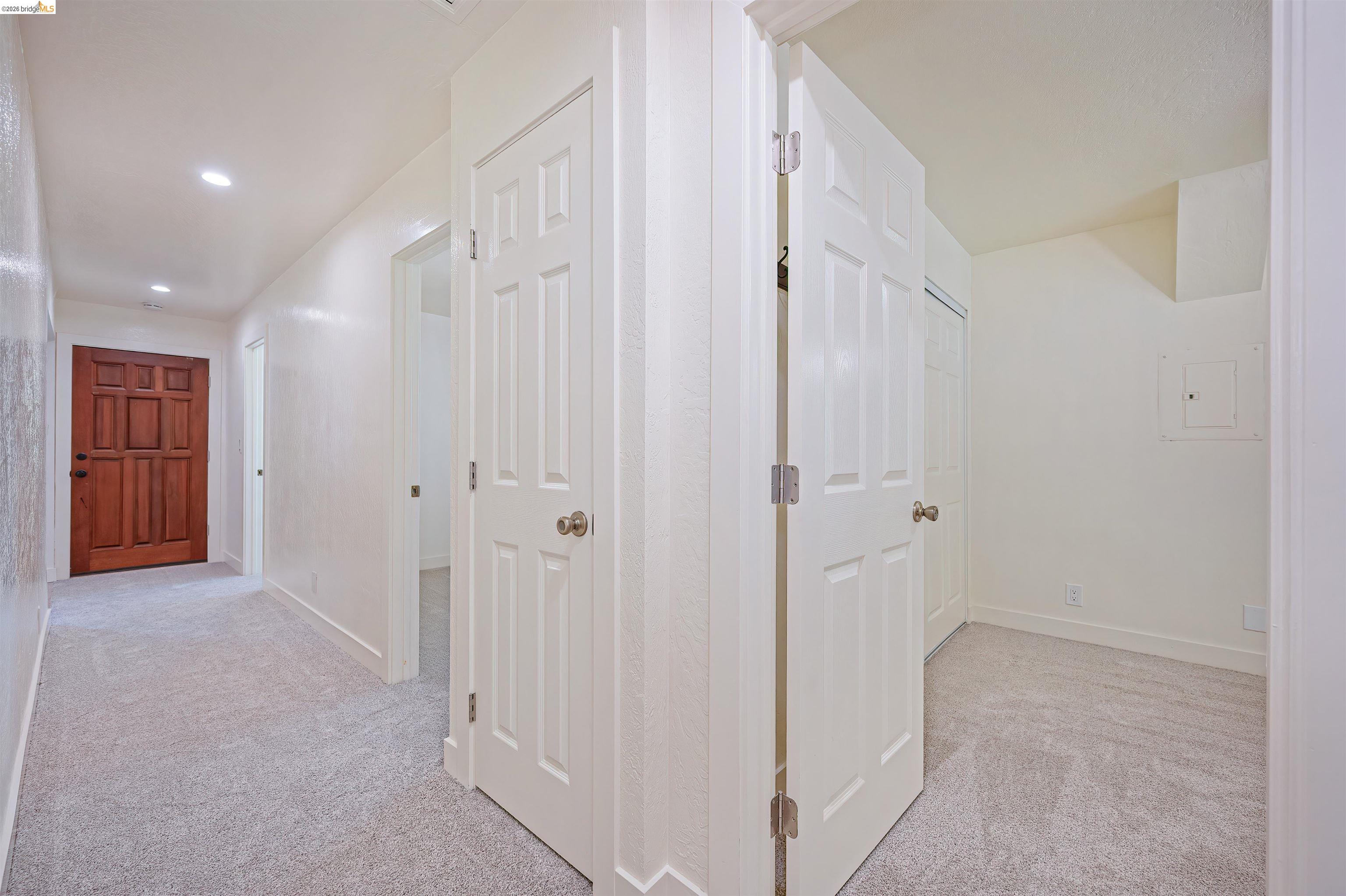 10474 Sheldon Road Elk Grove, CA 95624 - Photo 38 of 83 Hallway with recessed lighting, light gray carpeting, and white paneled doors