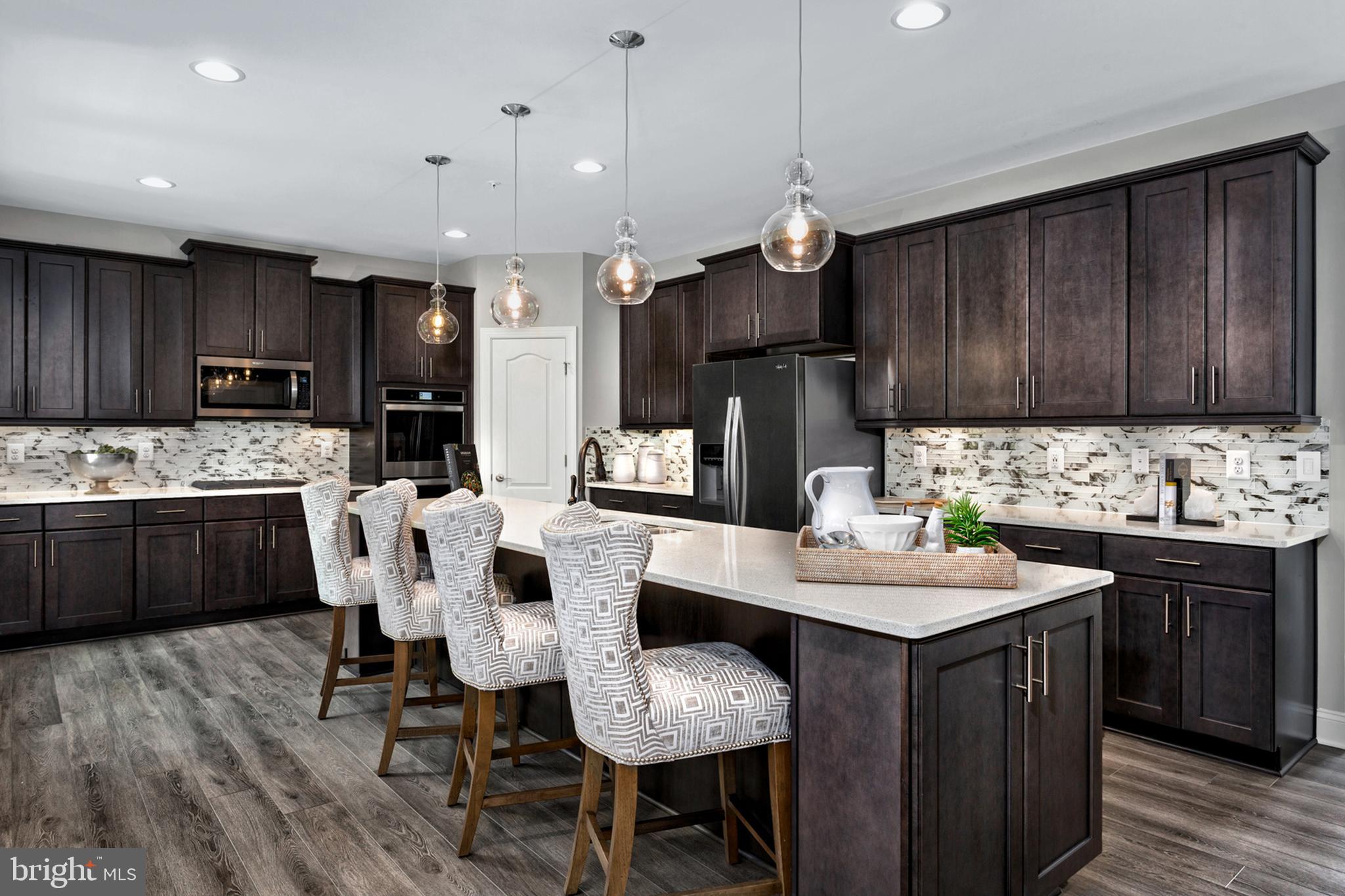 Tbb Enfield Farm Lane, Unit OAKDALE Brunswick, MD 21716 - Photo 2 of 21 a kitchen with granite countertop a sink appliances and cabinets