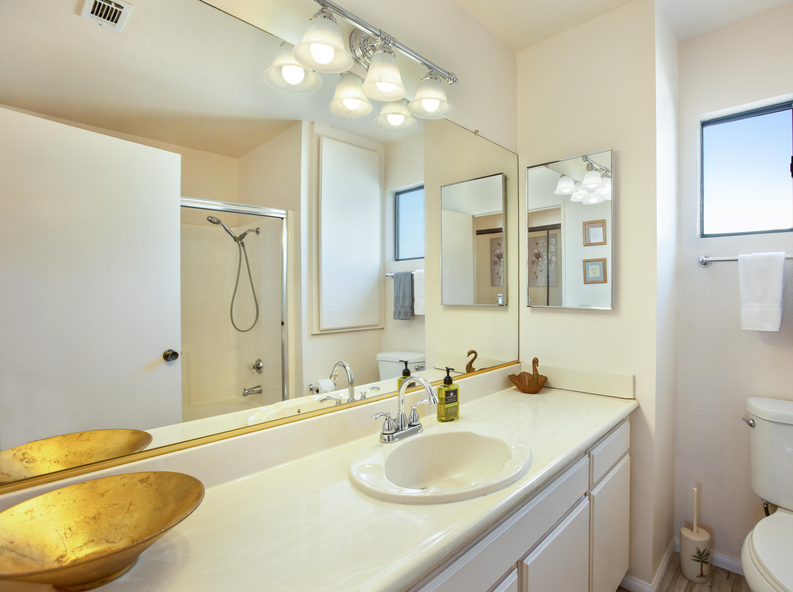 34352 Laura Way Rancho Mirage, CA 92270 - Photo 23 of 36 a bathroom with a granite countertop sink and a mirror