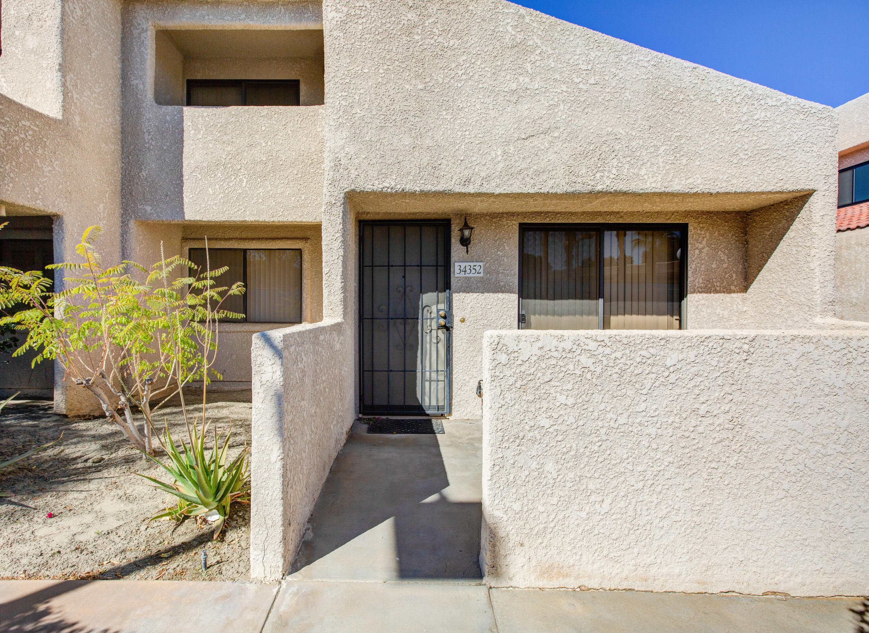 34352 Laura Way Rancho Mirage, CA 92270 - Photo 26 of 36 a front view of a house with outdoor space