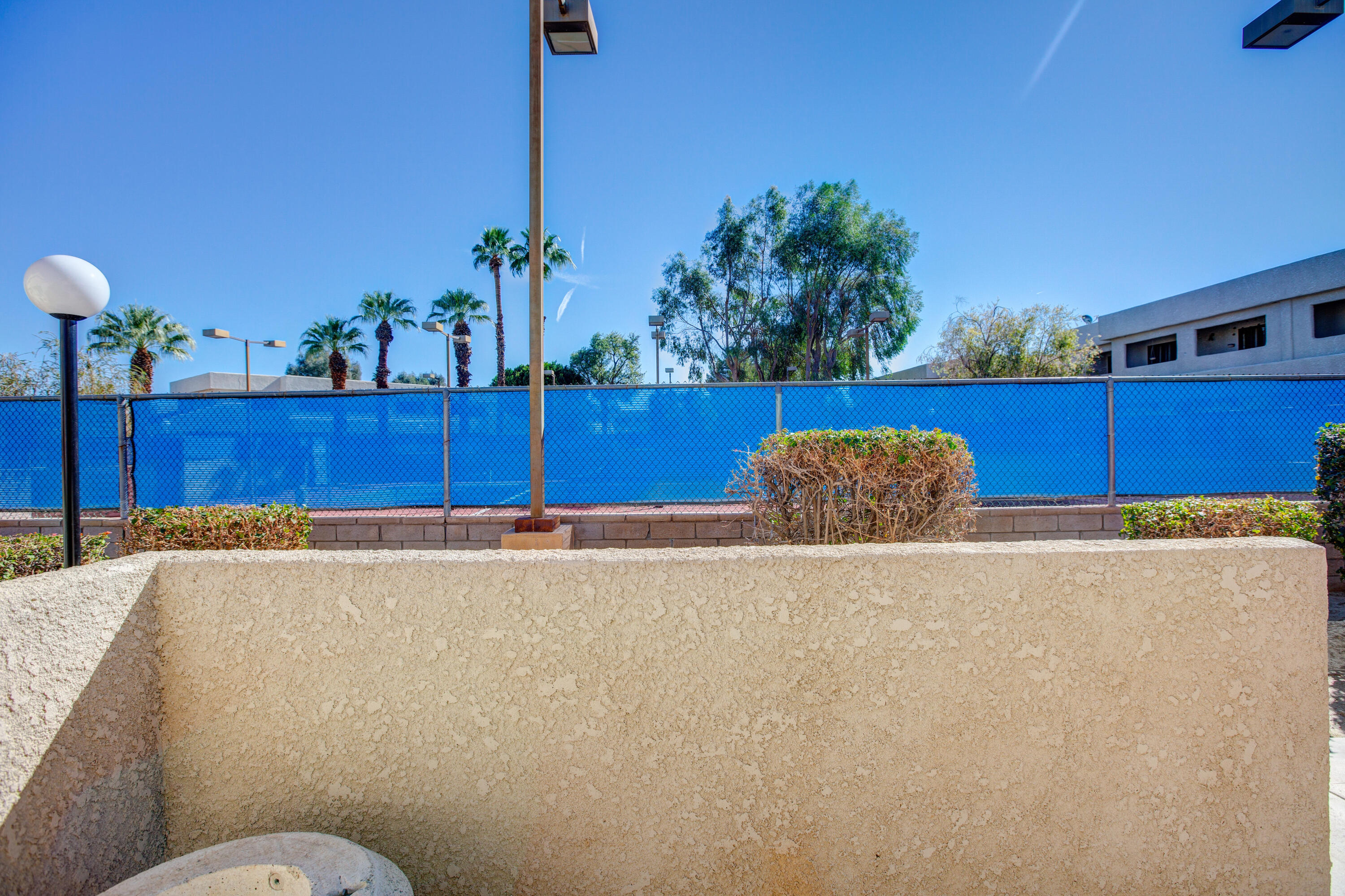 34352 Laura Way Rancho Mirage, CA 92270 - Photo 28 of 36 a bathroom with a granite countertop sink and a mirror
