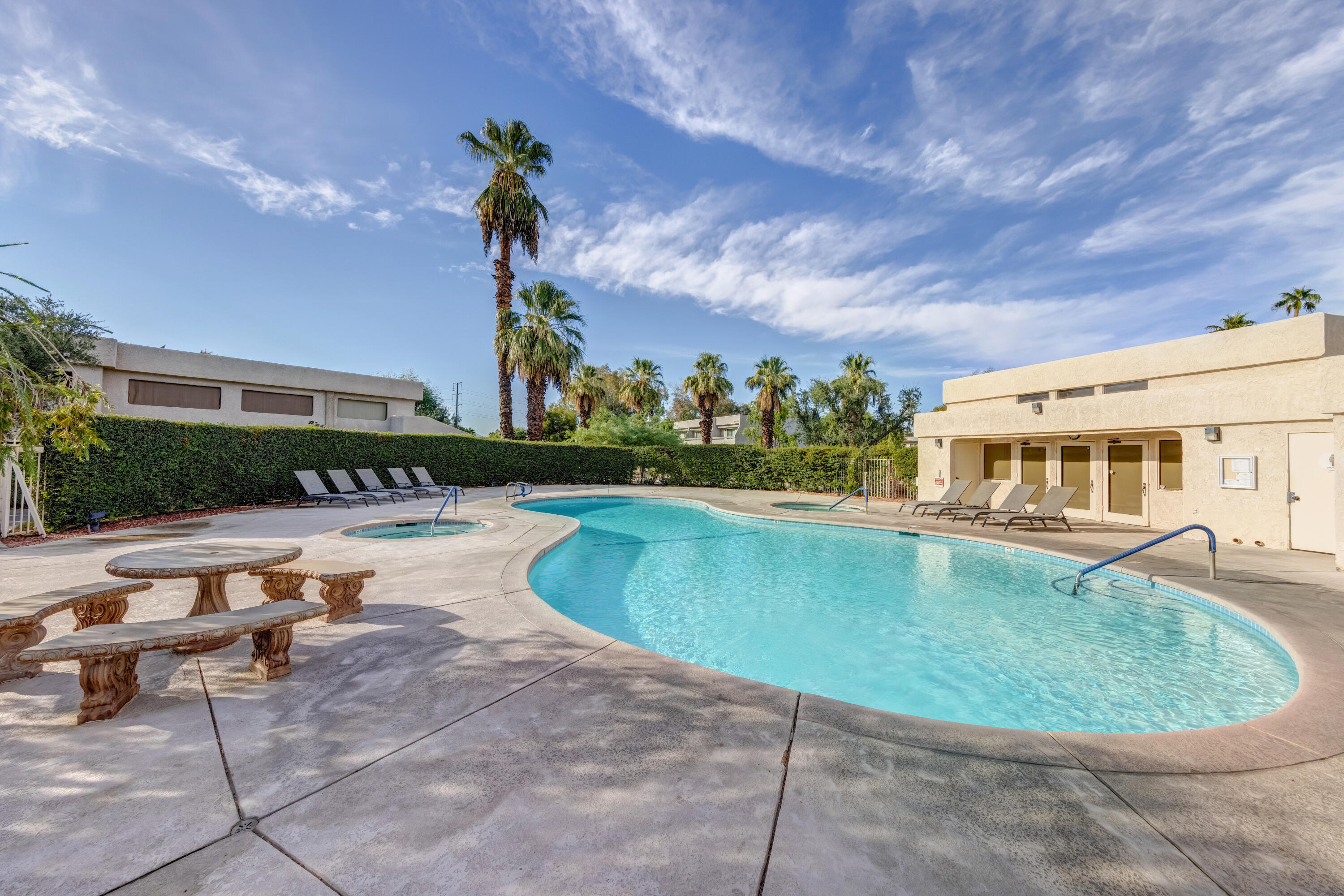 34352 Laura Way Rancho Mirage, CA 92270 - Photo 33 of 36 a view of a swimming pool with a patio