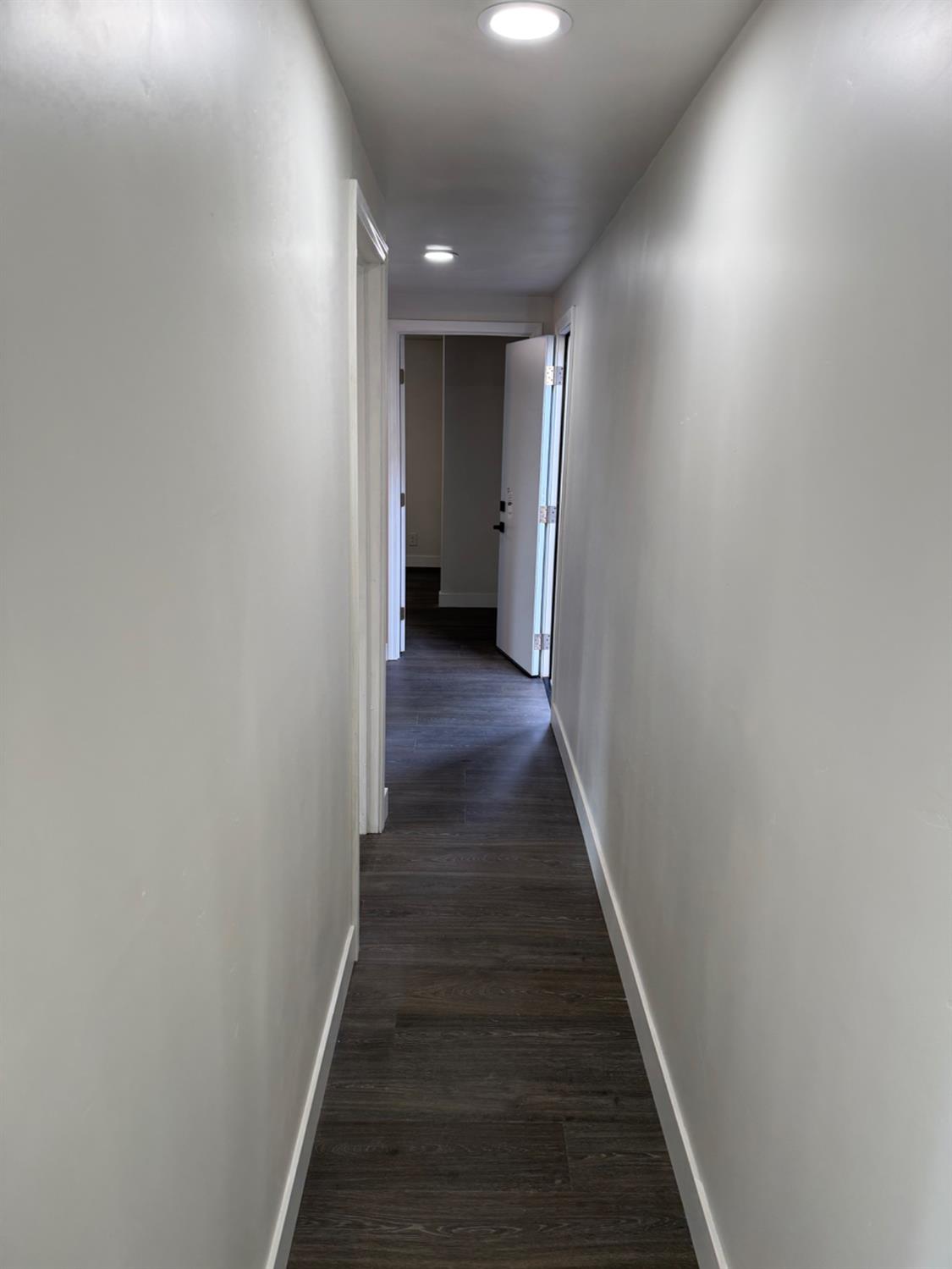 6060 Pony Express Trail, Unit 18 Pollock Pines, CA 95726 - Photo 17 of 17 a view of a hallway with wooden floor