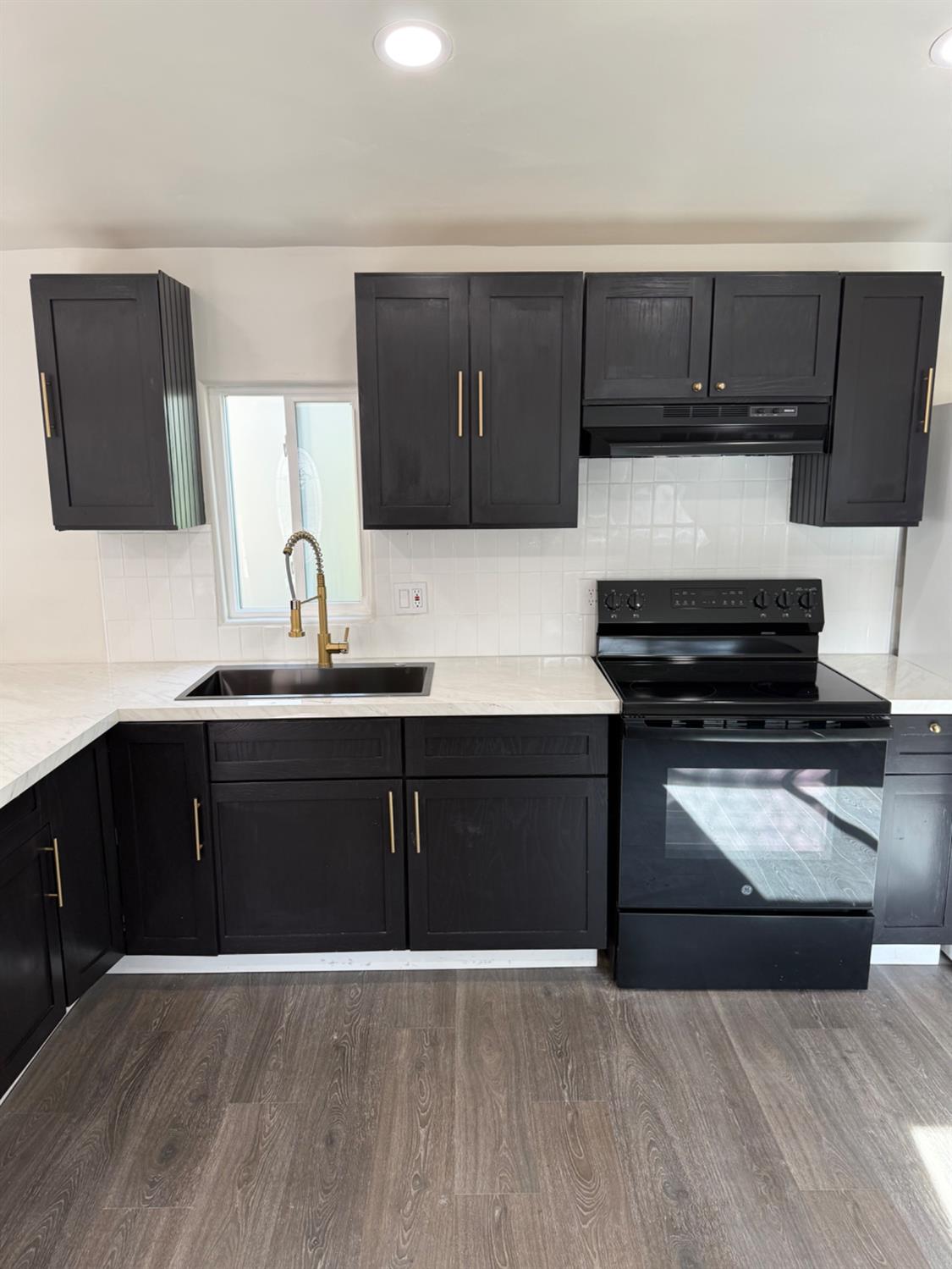 6060 Pony Express Trail, Unit 18 Pollock Pines, CA 95726 - Photo 8 of 17 a kitchen with a sink and a stove top oven