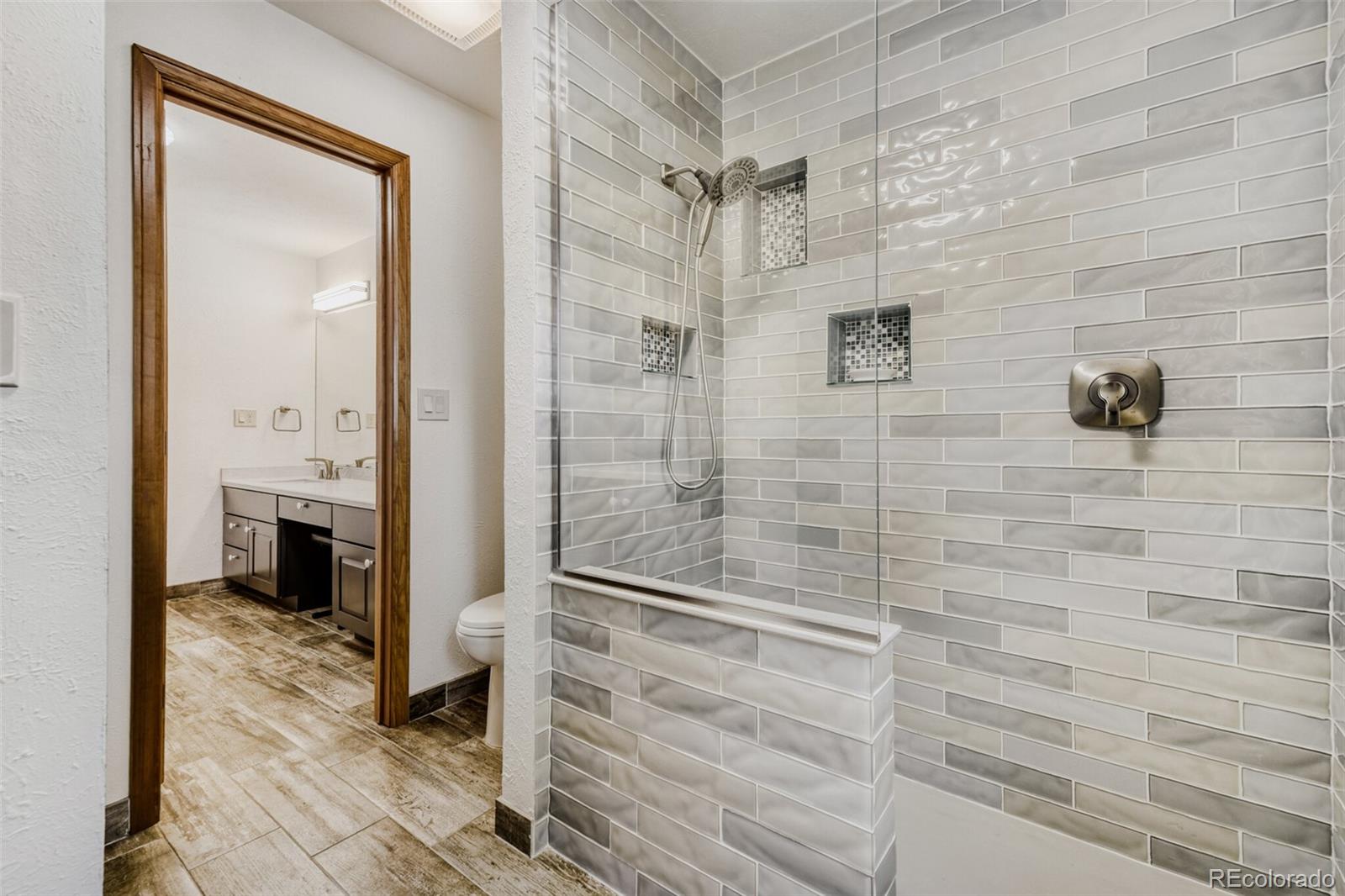 5000 Elizabeth Lane Evergreen, CO 80439 - Photo 15 of 30 a bathroom with a bathtub and a shower