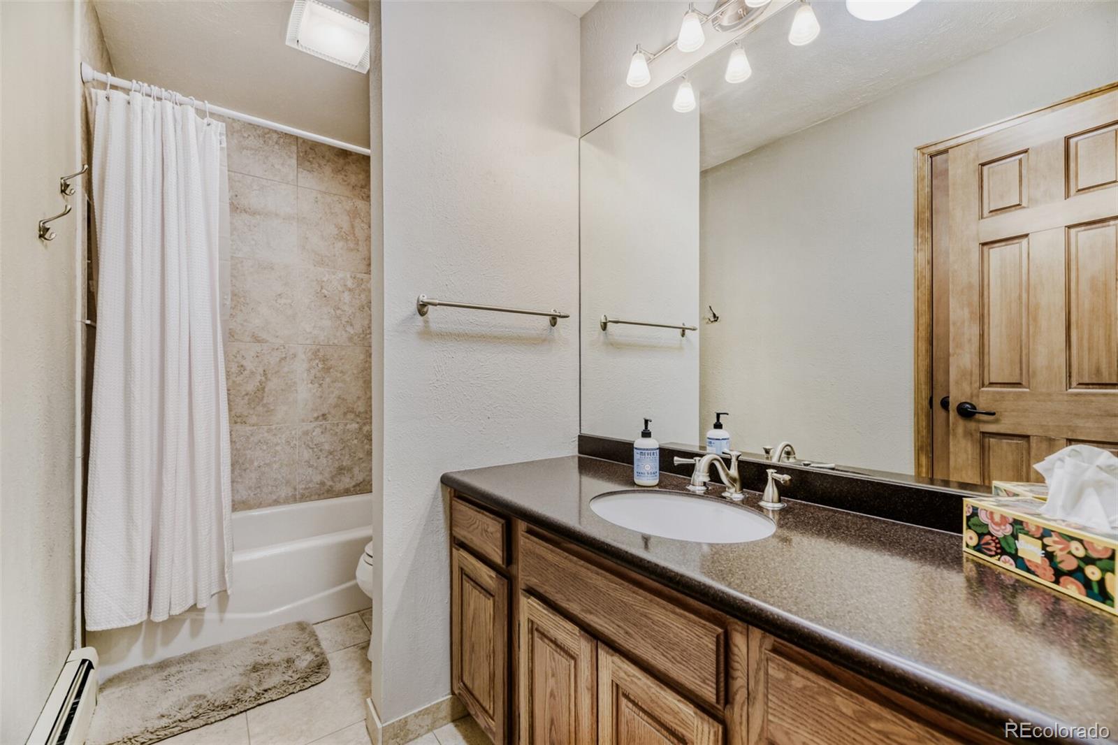5000 Elizabeth Lane Evergreen, CO 80439 - Photo 17 of 30 a bathroom with a sink double vanity and a bathtub